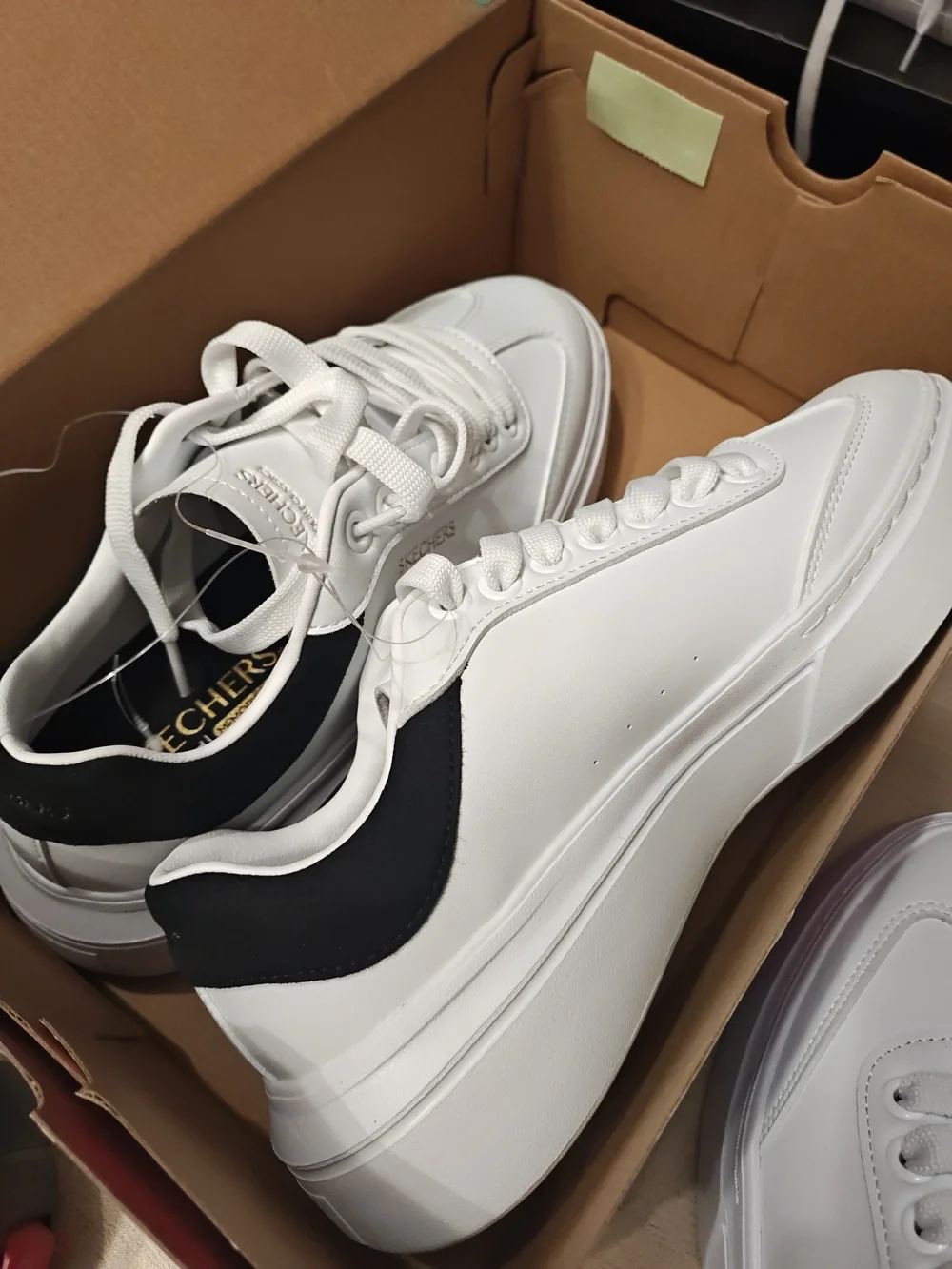 Skechers Men’s White Sneakers with Black Heel Accent 9